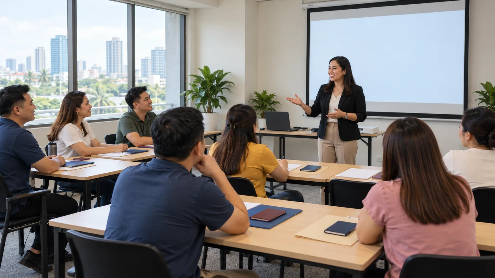 Filipino workers attending a pre-departure orientation seminar in a Manila training room